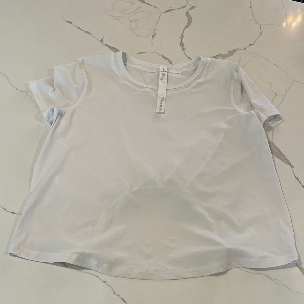 lululemon athletica White Short Sleeve tee with cutout back size 2